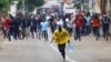 Mozambique police fire tear gas at protesters, injure journalist