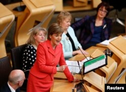 Scotland's First Minister, and leader of the Scottish National Party Nicola Sturgeon, speaks during First Minister's questions at the Scottish Parliament in Edinburgh, May 6, 2015.