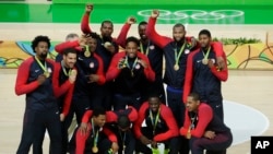 Rio Olympics Basketball Men: The United States' basketball team poses with their gold medals at the 2016 Summer Olympics in Rio de Janeiro, Brazil, Aug. 21, 2016. 