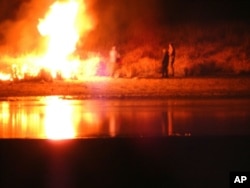 In this image provided by Morton County Sheriff’s Department, law enforcement and protesters clash near the site of the Dakota Access pipeline on Nov. 20, 2016, in Cannon Ball, N.D.