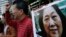 Anti-Beijing protesters hold picture of veteran Chinese journalist Gao Yu during a rally outside Chinese central government's liaison office in Hong Kong, as they demand the release of Gao, Nov. 27, 2015.