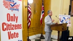 FILE - Luis Gil, a Republican candidate for Franklin County Commissioner in central Ohio, speaks in favor of a constitutional amendment on fall ballots that would prohibit noncitizen voting, at the Ohio Statehouse in Columbus, Ohio, on Oct. 6, 2022. 