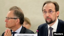 Newly appointed U.N. High Commissioner for Human Rights, Jordan's Prince Zeid Raad al-Hussein, right, speaks at the Human Rights Council. With him is Michael Moeller, the U.N. acting director-general, in Geneva, Sept. 8, 2014. 