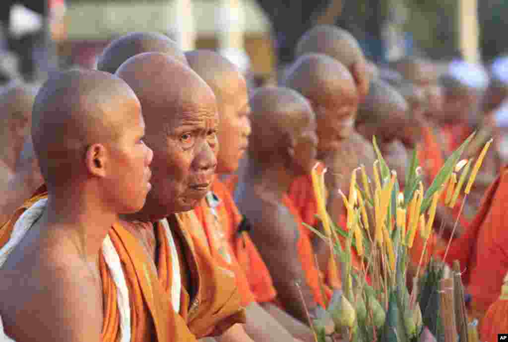 Buddhist monks offer prayers to Cambodian late King Norodom Sihanouk ahead of his cremation in front of the Royal Palace in Phnom Penh, Cambodia. 
