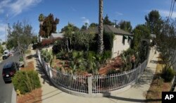 This photo shows the corner of Robert Chain's house in the Encino section of Los Angeles, Aug. 30, 2018. Chain, who was upset about The Boston Globe's coordinated editorial response to President Donald Trump's attacks on the news media, was arrested Thursday for threatening to travel to the newspaper's offices and kill journalists, whom he called the "enemy of the people," federal prosecutors said.