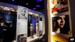 Gowns and outfits of Grammy winning performers are framed by pylons decorated with the covers of albums of the year winners during each decade at the Grammy Museum Mississippi in Cleveland, Mar. 2, 2016. This is the second and only official Grammy Museum outside of Los Angeles, California.