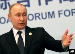 Russian President Vladimir Putin gestures while speaking to the media following the Belt and Road Forum in Beijing, China, April 27, 2019.