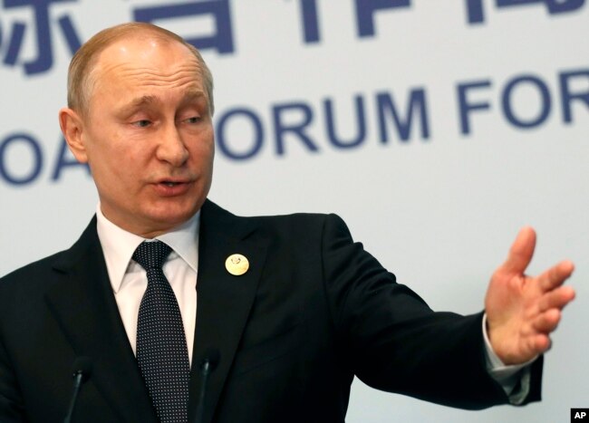 Russian President Vladimir Putin gestures while speaking to the media following the Belt and Road Forum in Beijing, China, April 27, 2019.