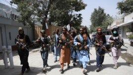 Taliban fighters patrol in the Wazir Akbar Khan neighborhood in the city of Kabul, Afghanistan, Wednesday, Aug. 18, 2021.