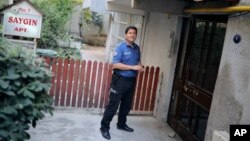 A Turkish police officer stands outside the house of American Pastor Andrew Craig Brunson, a 50-year-old evangelical pastor from Black Mountain, North Carolina, before his arrival, in Izmir, Turkey, July 25, 2018 after his release from a jail near Izmir. 