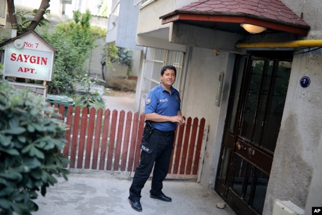 A Turkish police officer stands outside the house of American Pastor Andrew Craig Brunson, a 50-year-old evangelical pastor from Black Mountain, North Carolina, before his arrival, in Izmir, Turkey, July 25, 2018, after his release from a jail near Izmir.