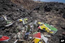 Wreckage lies at the scene of an Ethiopian Airlines flight that crashed shortly after takeoff at Hejere near Bishoftu, or Debre Zeit, some 50 kilometers (31 miles) south of Addis Ababa, in Ethiopia Sunday, March 10, 2019.