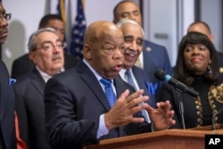 Rep. John Lewis, D-Ga., a leader of the civil rights movement, joins the Congressional Black Caucus Political Action Committee in endorsing Democratic presidential candidate Hillary Clinton during a news conference on Capitol Hill in Washington, Feb. 11, 2016.