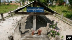 Incense stick holders stand at the cremation site of late Khmer Rouge leader Pol Pot in Anlong Veng, a former Khmer Rouge stronghold, about 305 kilometers (190 miles) north of Phnom Penh, Friday, April 11, 2008. (AP Photo/Heng Sinith)