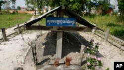 Incense stick holders stand at the cremation site of late Khmer Rouge leader Pol Pot in Anlong Veng, a former Khmer Rouge stronghold, about 305 kilometers (190 miles) north of Phnom Penh, Friday, April 11, 2008. (AP Photo/Heng Sinith)