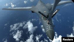 FILE - One of two U.S. Air Force B-1B Lancer bombers is refueled during a 10-hour mission flying to the vicinity of Kyushu, Japan, the East China Sea, and the Korean peninsula, over the Pacific Ocean, Aug. 8, 2017.