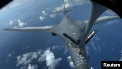 FILE - A U.S. Air Force B-1B bomber is refueled during a 10-hour mission flying to the vicinity of Kyushu, Japan, the East China Sea, and the Korean Peninsula, over the Pacific Ocean, Aug. 8, 2017.