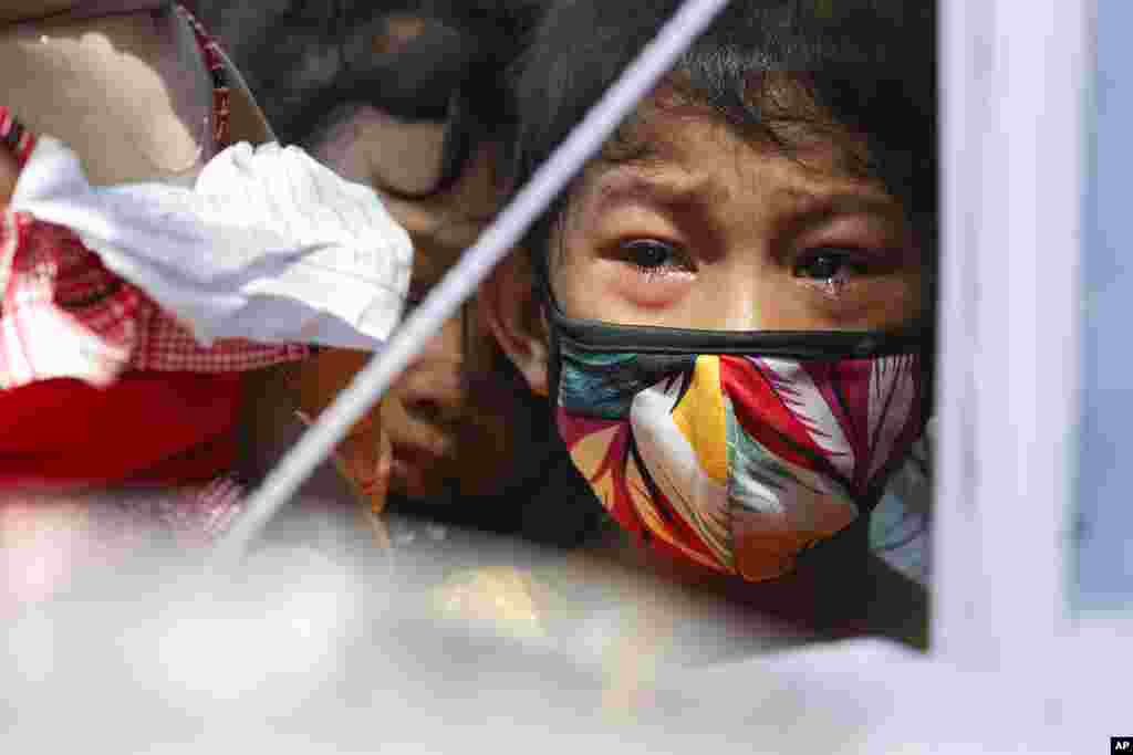 A tear drops as a girl grieves during the funeral of Lilibeth Valdez, who was shot by police, in Novaliches, Philippines. A number of shootings by policemen that led to civilian deaths sparked calls for an end to abuses in the 220,000-strong police force.