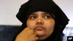 FILE - Bilkis Bano, one of the survivors of the Gujarat riot victims, gestures during a press conference in Ahmadabad, India, May 11, 2017.