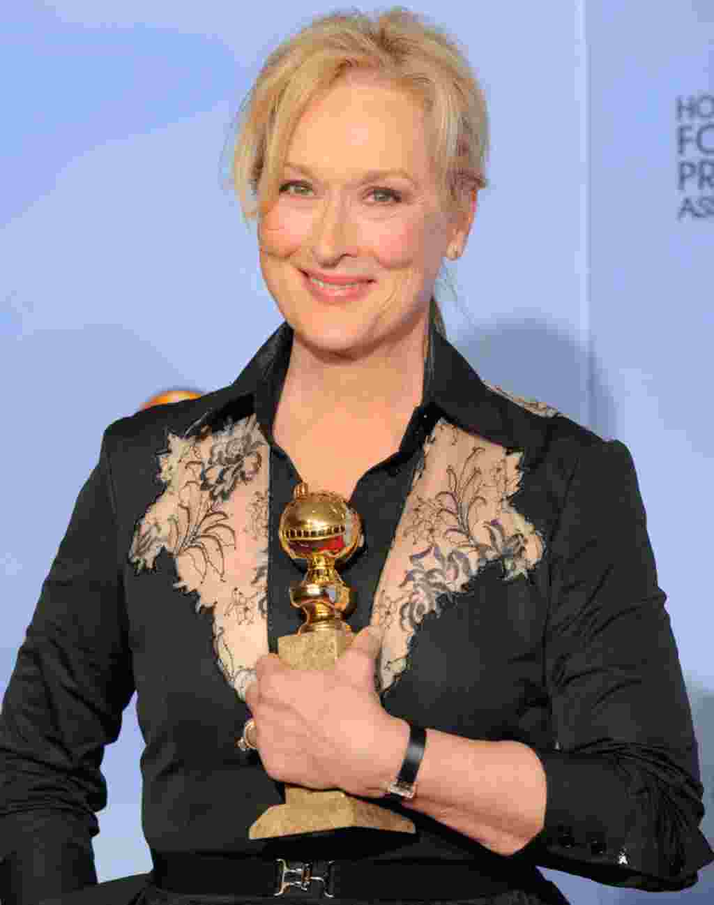 Actress Meryl Streep poses backstage with the award for Best Actress in a Motion Picture Drama for "The Iron Lady" during the 69th Annual Golden Globe Awards on January 15, 2012, in Los Angeles. (AP)