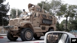 FILE - A U.S. armored vehicle patrols in Kabul, Afghanistan, Aug. 23, 2017.