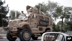 FILE - A U.S. armored vehicle patrols in Kabul, Afghanistan, Aug. 23, 2017.