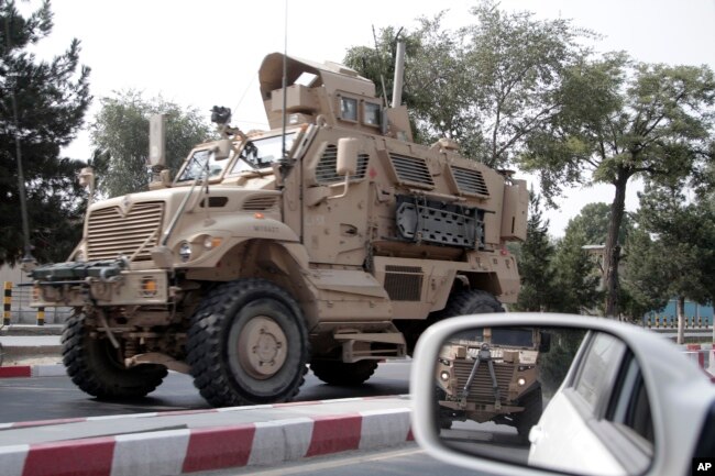 FILE - A U.S. armored vehicle patrols in Kabul, Afghanistan, Aug. 23, 2017.
