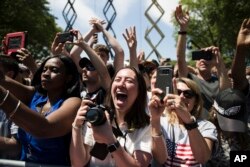 Attendees cheer as Democratic presidential candidate Joe Biden arrives at a campaign rally at Eakins Oval in Philadelphia, May 18, 2019.