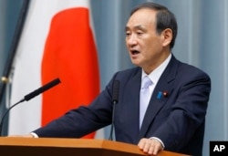 Japan's Chief Cabinet Secretary Yoshihide Suga speaks during a press conference to announce cabinet changes at the prime minister's official residence in Tokyo, Aug. 3, 2017.