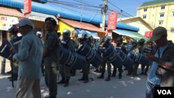 Police Block Mourners During Memorial for 2014 Killings of Workers
