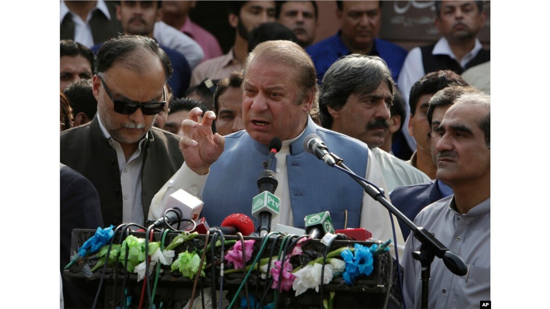 FILE - Nawaz Sharif addresses a crowd during his visit to a mausoleum of Pakistani poet Mohammad Iqbal on the occasion of Pakistan Independence Day in Lahore, Aug. 14, 2017.