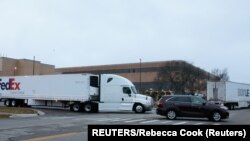 USA, Michigan, Portage, A FedEx truck leaves the Pfizer Global Supply.