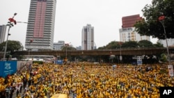 Activists from the Coalition for Clean and Fair Elections (BERSIH) gather on a main road in downtown Kuala Lumpur, Malaysia, during a rally, Aug. 30, 2015.