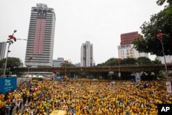 Activists from the Coalition for Clean and Fair Elections (BERSIH) gather on a main road in downtown Kuala Lumpur, Malaysia, during a rally, Aug. 30, 2015.