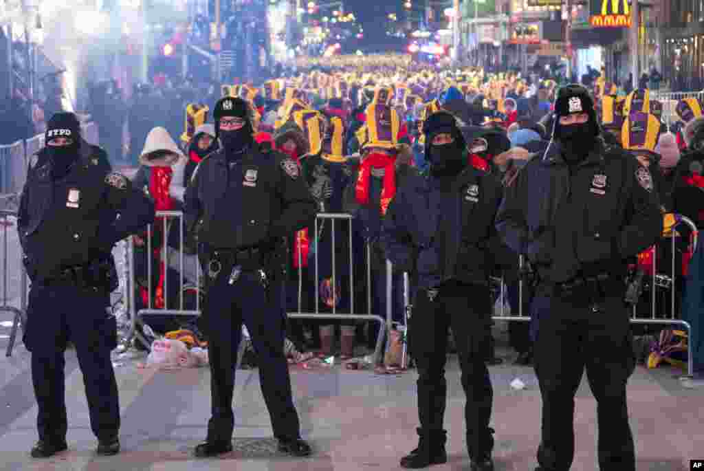 New York City police officers are seen on Times Square in New York, Dec. 31, 2017, during a New Year&#39;s Eve celebration.