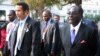 FILE: Botswana President Ian Khama (L) walks alongside Zimbabwe President Robert Mugabe (R) during a lunch break at the SADC summit in Maputo, June 15, 2013. 