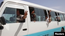 Members of the Yazidi minority sect who were newly released are seen in a vehicle on the outskirts of Kirkuk, April 8, 2015. 