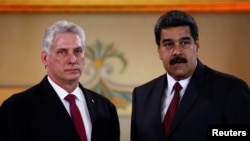 El presidente de Cuba, Miguel Díaz Canel durante una visita al presidente de Venezuela, Nicolás Maduro, en el Palacio de Miraflores en Caracas, en 2018.