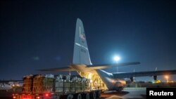 FILE — Over 38,000 Meals Ready to Eat and water destined for an airdrop over Gaza are loaded aboard a U.S. Air Force C-130J Super Hercules at an undisclosed location in Southwest Asia, March 1, 2024.