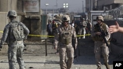 US soldiers keep watch after an attack at Camp Phoenix in Kabul, Afghanistan, April 2, 2011