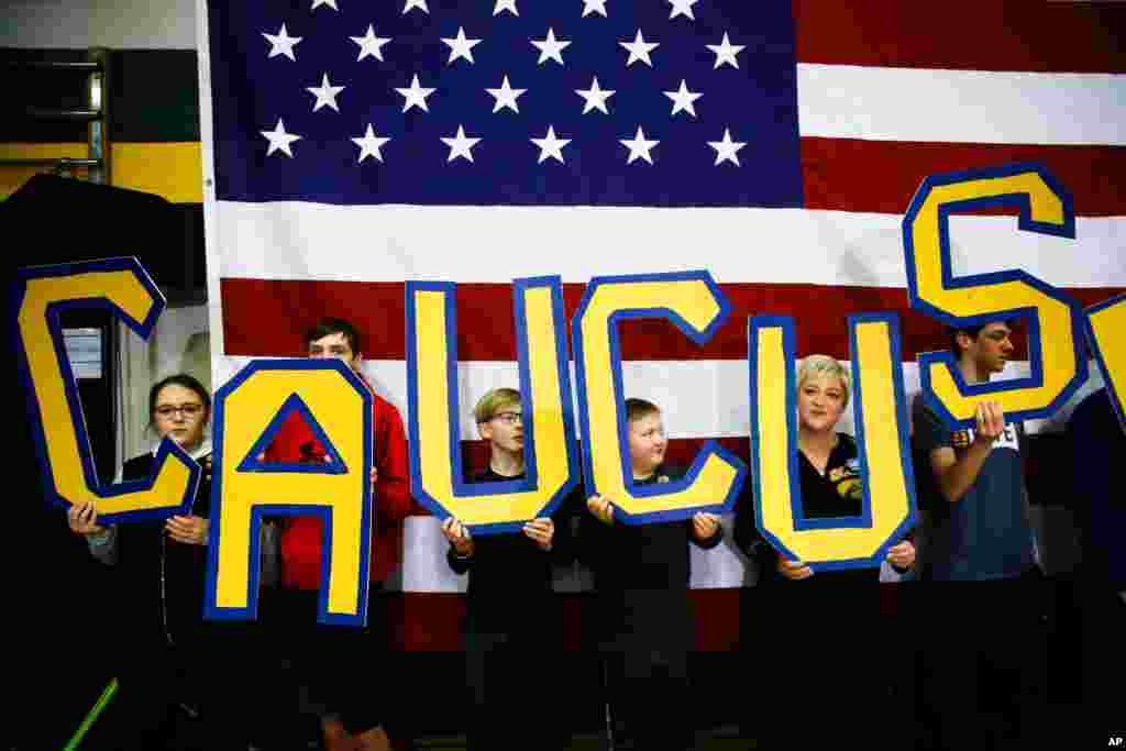 Attendees hold letters that read &quot;CAUCUS&quot; during a campaign event in South Bend, Indiana, Feb. 2, 2020.