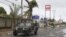 A navy vehicle drives along a street in the coastal town of Barra de Navidad as the community prepares for the arrival of Hurricane Bud along the Pacific coast of Mexico, May 25, 2012. 