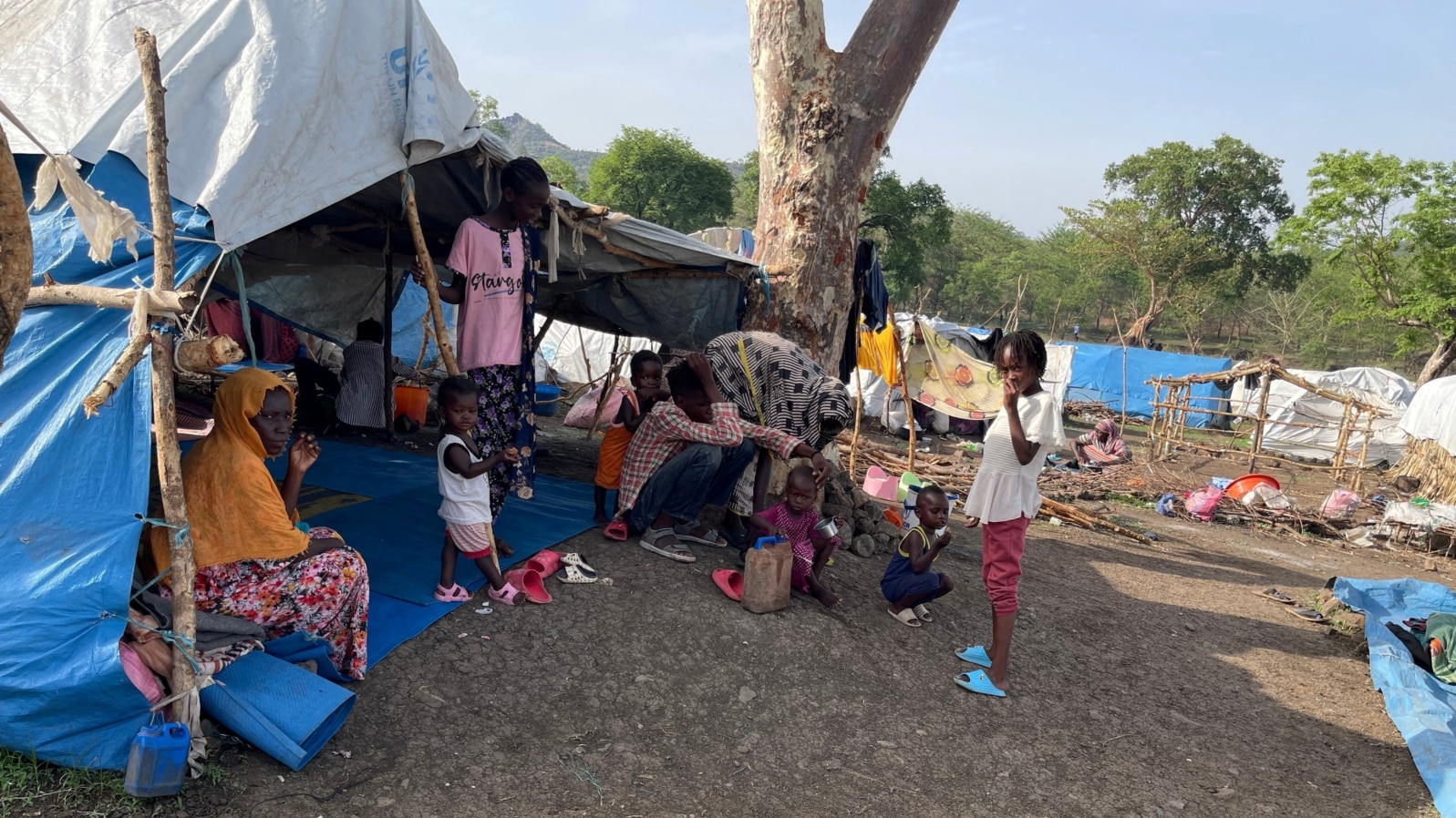 FILE - People look on at makeshift shelters near Awlala Camp, Amhara region, Ethiopia, May 31, 2024. UNICEF reported on Jan. 7, 2025, that 4.4 children in Amhara are unschooled due to disasters and violence. (Alfatih Alsemari via Reuters)