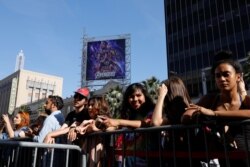 Avengers fans wait in line at the TCL Chinese Theatre in Hollywood to attend the opening screening of 'Avengers: Endgame' in Los Angeles, California, April 25, 2019.