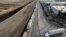 Aerial view of trucks queueing next to the border wall before crossing to the United States at Otay commercial port in Tijuana, Baja California state, Mexico, Jan. 22, 2025. 