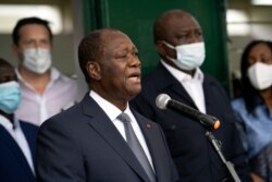 FILE - Ivory Coast President Alassane Ouattara speaks to journalists after voting at a polling station during presidential elections in Abidjan, October 31, 2020.