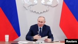 Russian President Vladimir Putin chairs a meeting on development of unmanned aviation in the city of Togliatti, Russia, Jan. 28, 2025. (Sputnik/Vyacheslav Prokofyev/Pool via Reuters)