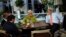 U.S. Secretary of State John Kerry, right, U.S. Under Secretary for Political Affairs Wendy Sherman, center, National Security Council point person on the Middle East Robert Malley, and Chief of Staff Jon Finer, front, meet on the terrace of a hotel where