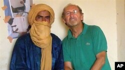 Undated handout photo with unknown dateline supplied by the Gerardmer-Tidarmene association shows Pierre Camatte (R), 61, posing with an unidentified man. Camatte was kidnapped overnight on 25 Nov 2009 in Menaka, northern Mali.