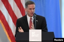 FILE - USAID administrator Mark Green introduces U.S. first lady Melania Trump at a reception on her initiative "Be Best" at the United States mission to the U.N. on the sidelines of the United Nations General Assembly in New York, Sept. 26, 2018.